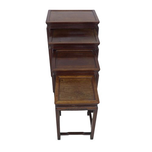 365 - A nest of four Chinese hardwood side tables, with relief decorated frieze, 51 by 36 by 67cm high.