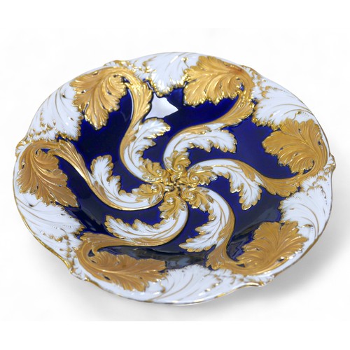 181 - A 19th century Meissen bowl, decorated with gilt acanthus leaf designs on a blue ground, with cross ... 