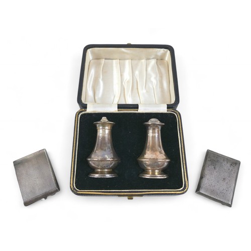 98 - Two silver match cases and a boxed cruet, total weight 124.5g/4.0toz. (1 bag)