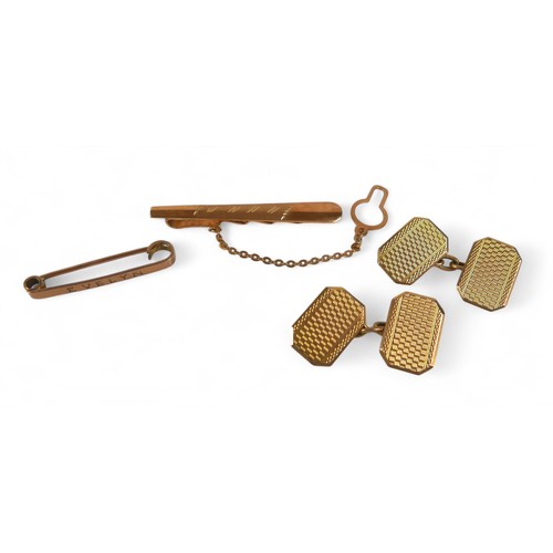 52 - A pair of 9ct yellow gold cufflinks, a tie clip and a pin, total weight 10.5g. (4)