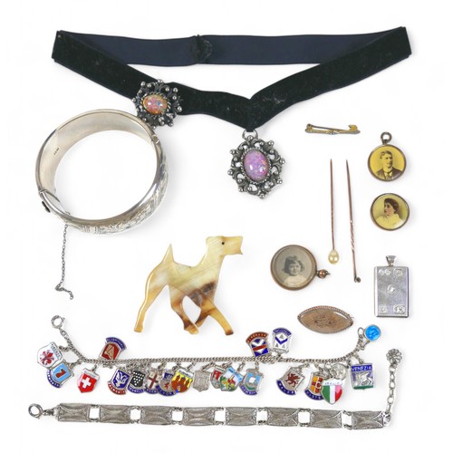 31 - A horn dog brooch and other jewellery, including a silver bangle. (1 bag)