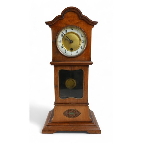 276 - A mahogany mantle clock in the form of a long case clock, 22 by 14 by 46cm high.