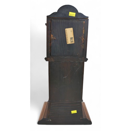 276 - A mahogany mantle clock in the form of a long case clock, 22 by 14 by 46cm high.