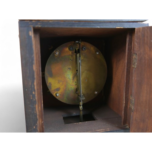 276 - A mahogany mantle clock in the form of a long case clock, 22 by 14 by 46cm high.