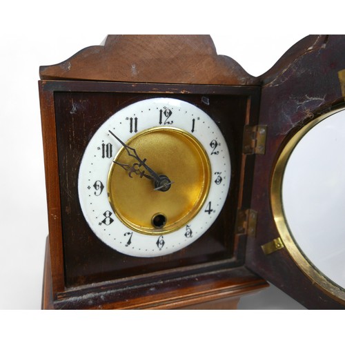 276 - A mahogany mantle clock in the form of a long case clock, 22 by 14 by 46cm high.