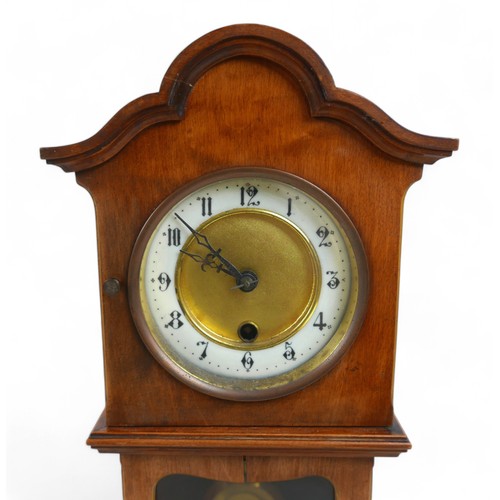 276 - A mahogany mantle clock in the form of a long case clock, 22 by 14 by 46cm high.