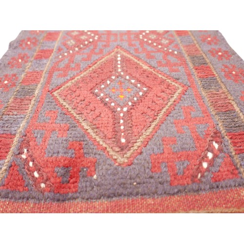 379 - Meshwani hand knotted woollen runner rug, 244 by 55cm.