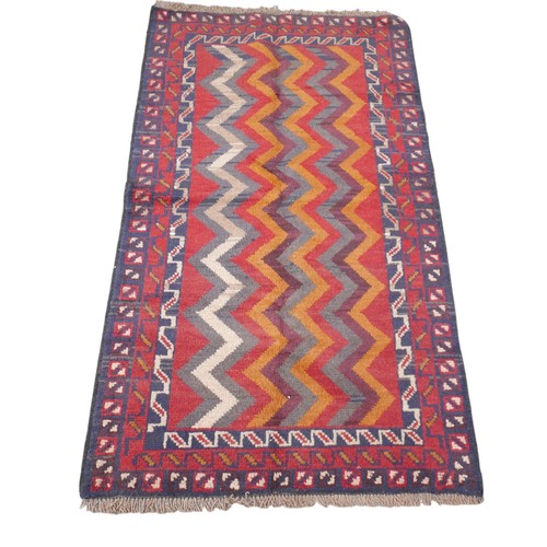 376 - Baluchi hand knotted woollen rug, 140 by 84cm.