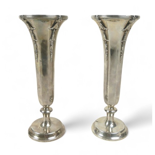 121 - A pair of weighted silver flute vases, William Comyns & Sons, London 1912, 20.5cm high. (2)