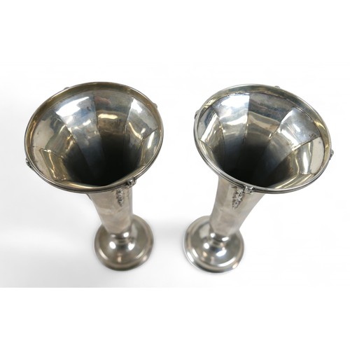 121 - A pair of weighted silver flute vases, William Comyns & Sons, London 1912, 20.5cm high. (2)