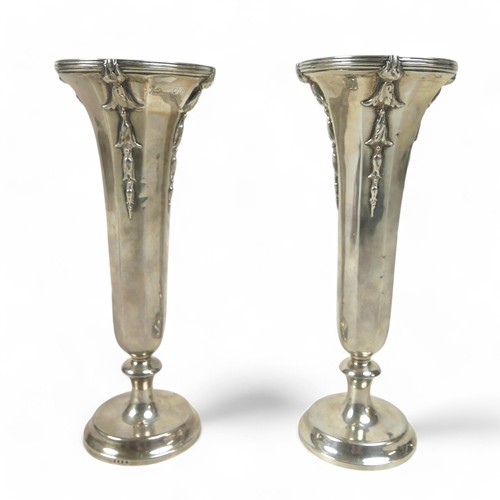 121 - A pair of weighted silver flute vases, William Comyns & Sons, London 1912, 20.5cm high. (2)