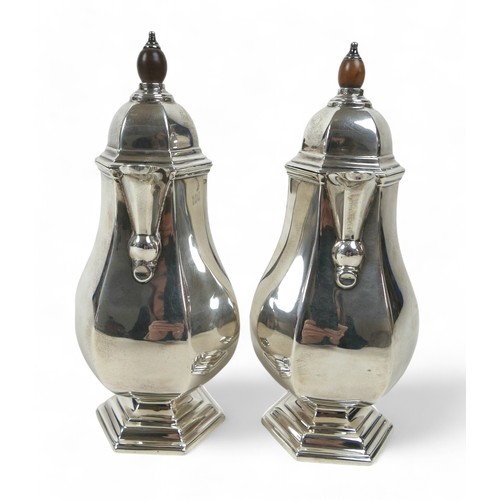 130 - A pair of silver coffee pots, each of hexagonal form, possibly R H Halford & Sons Ltd, London 1925, ... 