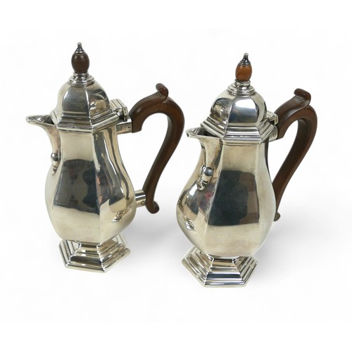 130 - A pair of silver coffee pots, each of hexagonal form, possibly R H Halford & Sons Ltd, London 1925, ... 