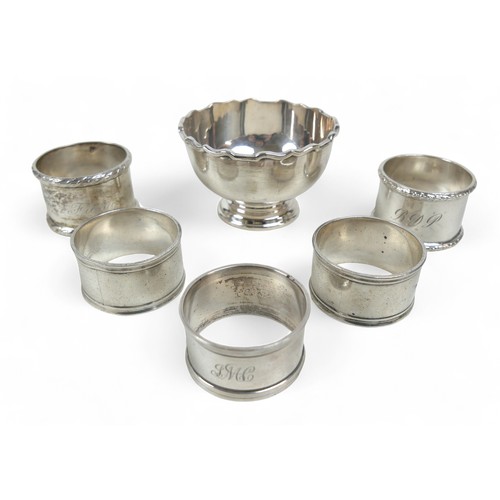 112 - A group of silver items, comprising a footed sugar bowl, Atkin Brothers, Sheffield 1946, 8 by 8 by 5... 