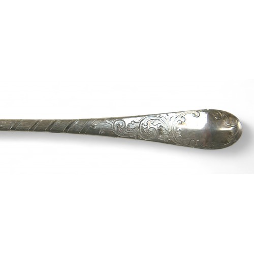 104 - A pair of Georgian silver berry spoons, each with engraved handles, scalloped edge and gilt washed b... 