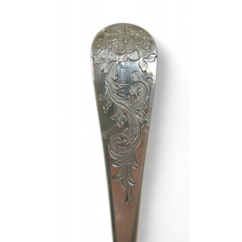 104 - A pair of Georgian silver berry spoons, each with engraved handles, scalloped edge and gilt washed b... 