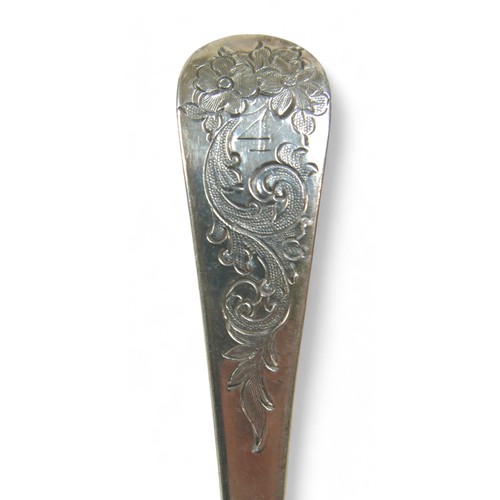 104 - A pair of Georgian silver berry spoons, each with engraved handles, scalloped edge and gilt washed b... 