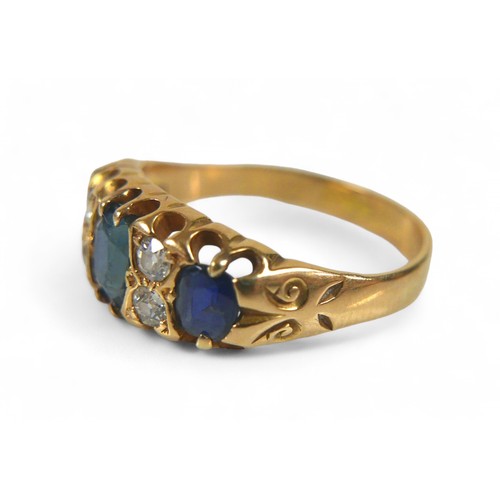 60 - An 18ct gold, sapphire and diamond ring, three oval cut sapphire, the largest, measuring approximate... 