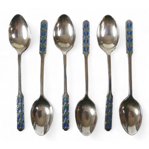 126 - A boxed set of six silver and enamel Liberty teaspoons with sugar tongs, Birmingham 1926, in origina... 