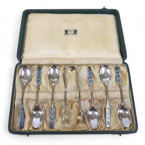 126 - A boxed set of six silver and enamel Liberty teaspoons with sugar tongs, Birmingham 1926, in origina... 