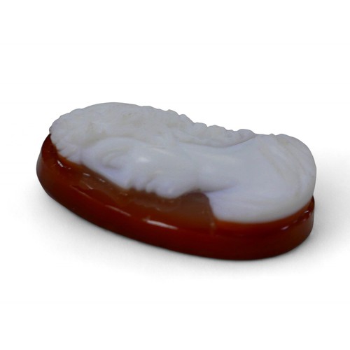 66 - An early 19th carnelian white stone cameo of Apollo, 3 by 4cm.