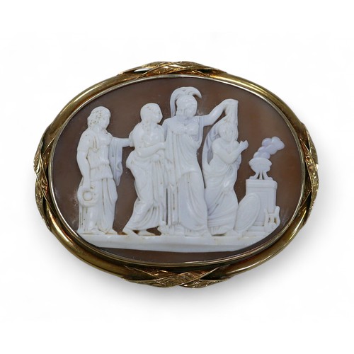 68 - A Victorian 15ct gold mounted cameo brooch, with a depiction of a classical ceremonial altar scene, ... 