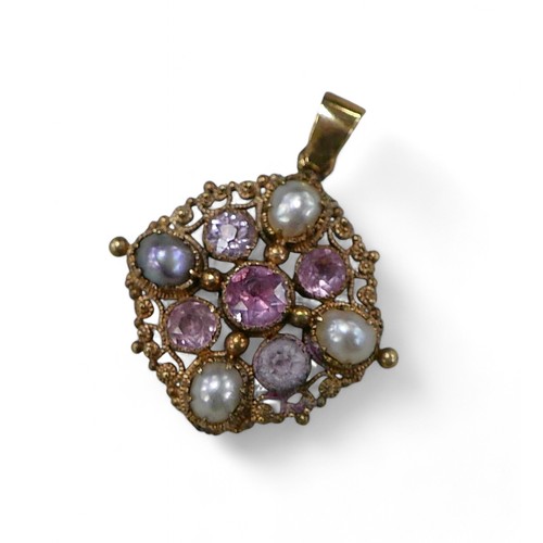 54 - A pink stone and half pearl gold pendant, with cannetille work design, 2.2 by 2.7cm overall, 3.5g.