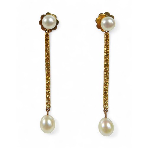 65 - A pair of 18ct gold pearl and yellow sapphire drop earrings, each earring with a two cultured pearls... 