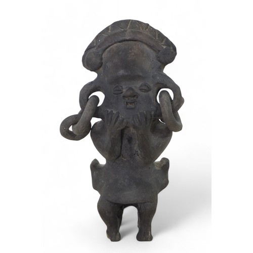 185 - A black ware figure, possibly pre-Columbian, 10 by 6 by 20cm high.