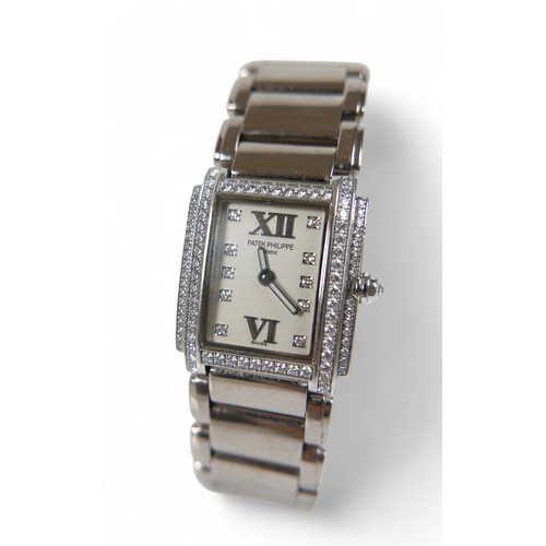 157 - A Patek Philippe ladies 18ct white gold diamond bracelet wristwatch, model TWENT-4 number 4908/200G-... 