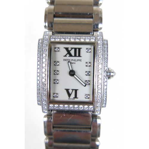 157 - A Patek Philippe ladies 18ct white gold diamond bracelet wristwatch, model TWENT-4 number 4908/200G-... 