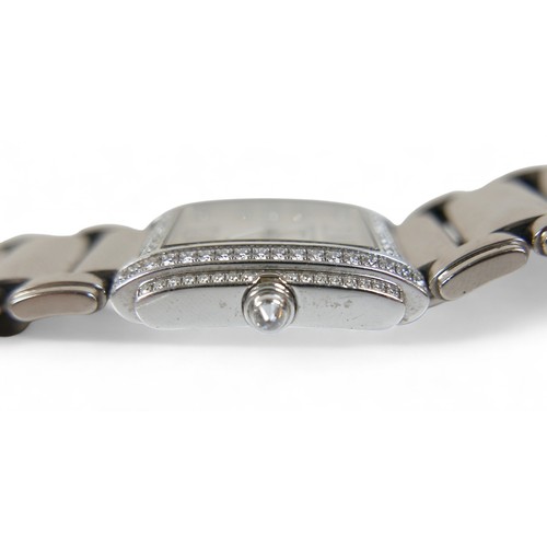 157 - A Patek Philippe ladies 18ct white gold diamond bracelet wristwatch, model TWENT-4 number 4908/200G-... 