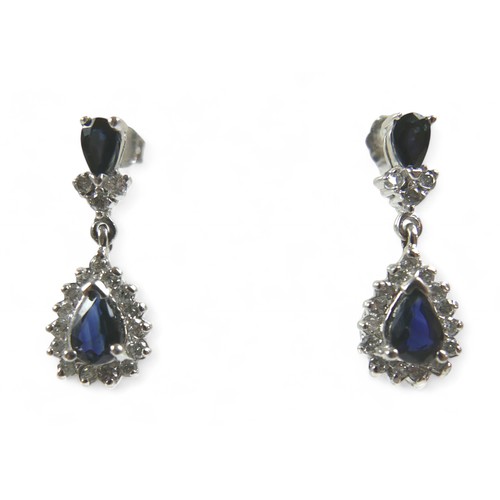 86 - A white gold sapphire and diamond earring and pendant necklace set, pear shaped setting in 14ct whit... 