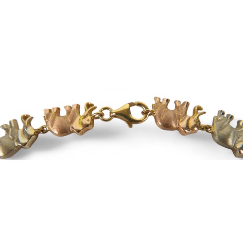 91 - An 18ct tri-colour gold suite of elephant jewellery, comprising a 45cm long necklace, bracelet, earr... 