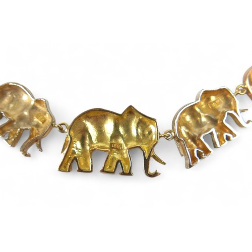 91 - An 18ct tri-colour gold suite of elephant jewellery, comprising a 45cm long necklace, bracelet, earr... 