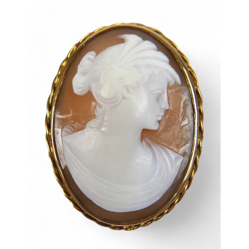 42 - Two gilt metal cameo brooches, largest 36.7 by 12.9 by 51.4mm. (2)