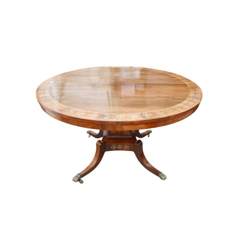 381 - A Regency brass inlaid rosewood breakfast table, on a square platform base, and out-swept legs termi... 