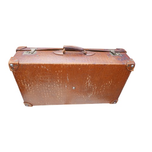 283 - A vintage faux leather faux crocodile suitcase 75 by 42 by 21cm.