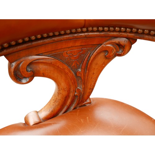 370 - A Victorian button leather mahogany library chair on turned legs, 62 by 59 by 74cm high.