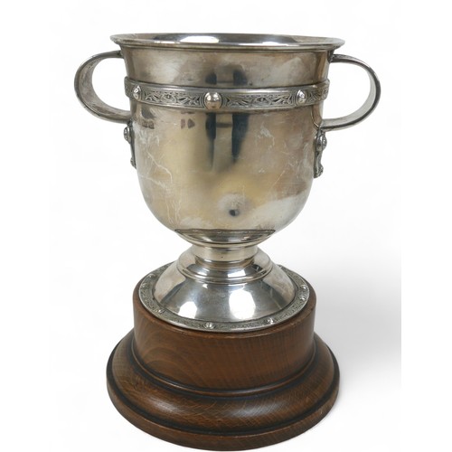 122 - A silver two-handled presentation cup, Birmingham 1938, maker WG & S for William Greenwood & Sons, d... 