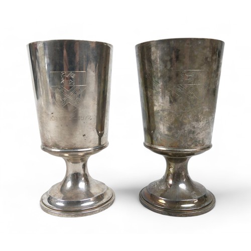 125 - A pair of silver gilt goblets, Birmingham marked BES Co for Barker Ellis Silver Co, each engraved to... 