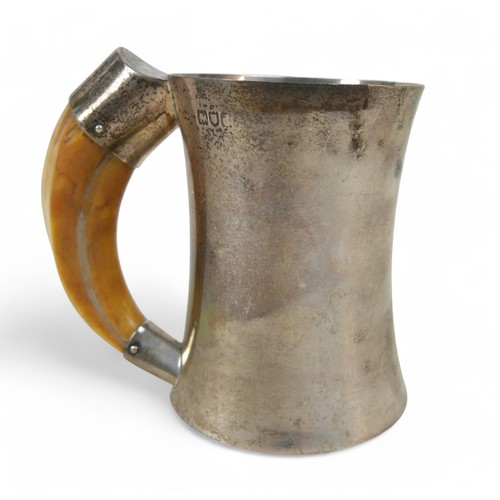 117 - A Victorian silver tankard with boar tusk handle, London 1899, by Heath & Middleton, 11 cm wide, 11c... 