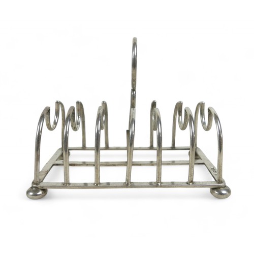 108 - A silver toast rack on four ball feet, Chester 1904, Maker GNRH for George Nathan & Ridley Hayes, 14... 