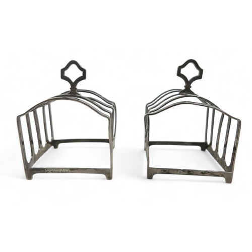 109 - A pair of silver toast racks, Birmingham 1928, stamped Wm Greenwood & Sons Leeds & Huddersfield, one... 