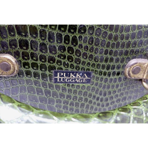 285 - Vintage Luggage; A set of four Pukka Luggage green faux crocodile leather effect suitcases (assorted... 