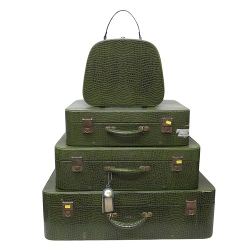 285 - Vintage Luggage; A set of four Pukka Luggage green faux crocodile leather effect suitcases (assorted... 