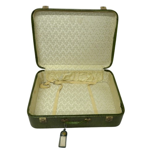 285 - Vintage Luggage; A set of four Pukka Luggage green faux crocodile leather effect suitcases (assorted... 