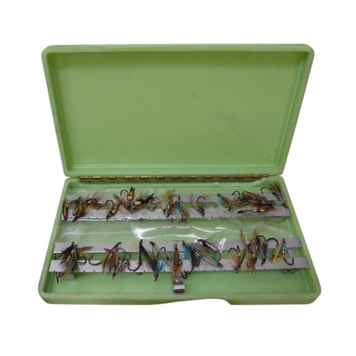 272 - Fishing: A vintage collection of fly fishing flies, lures, weight, hooks and other equipment in  Umc... 