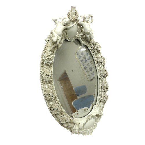 333 - A 19th century Meissen blanc de chine easel back mirror, decorated with putti and foliate posies, 46... 