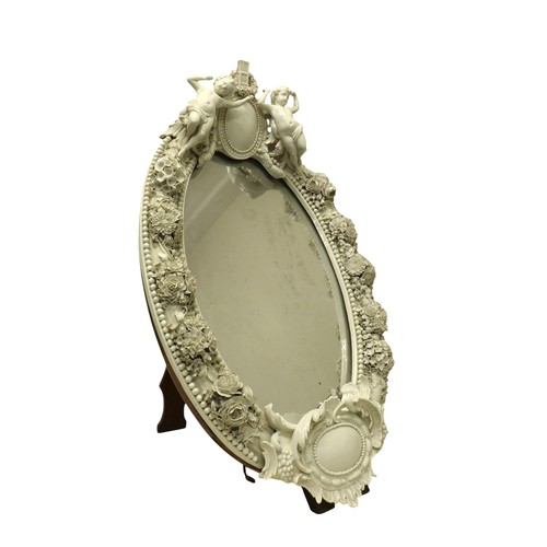 333 - A 19th century Meissen blanc de chine easel back mirror, decorated with putti and foliate posies, 46... 